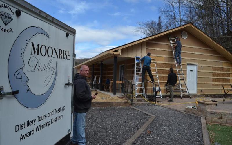 Wayne Knuckles/The Clayton Tribune. Doug Nassaur looks over expansion work currently underway at Moonrise Distillery in Clayton.