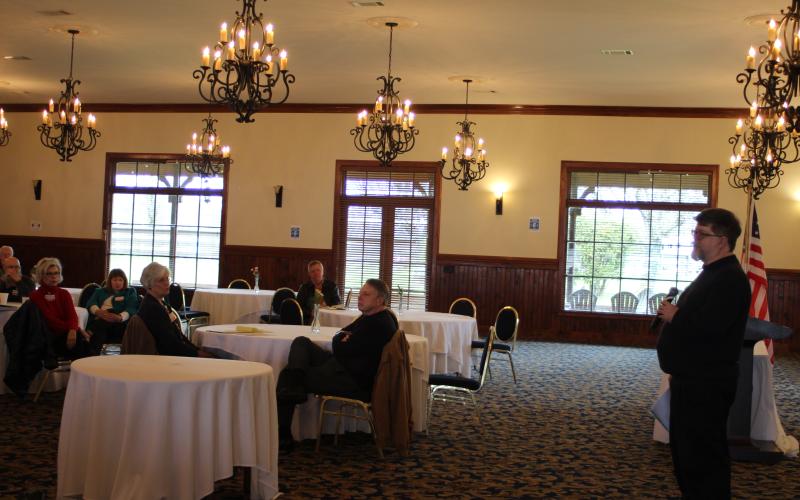 Megan Broome/The Clayton Tribune. The Rabun County Republicans hosted guest speaker Mike Seigle at their March Republican Party meeting held at The Dillard House Conference Center Saturday. Rabun Republican Party members Connie Holcomb, back left, Linda Burns and President Sam Burns hear remarks from Seigle about election demographics and marketing strategies for the party.