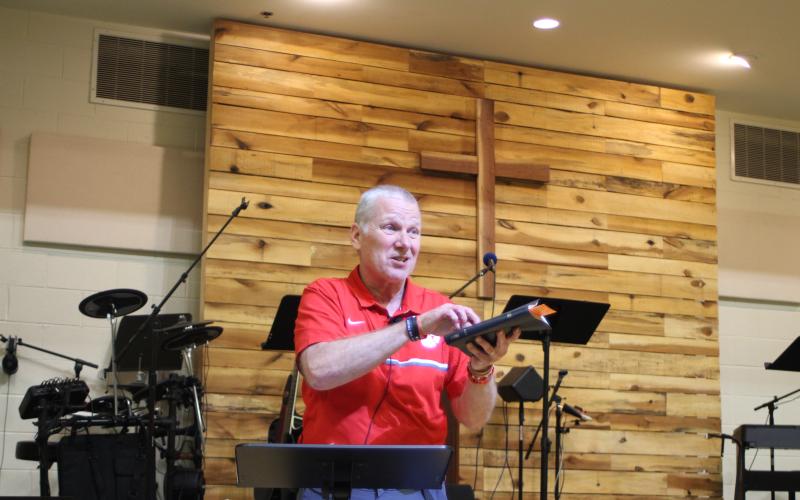 Megan Broome/The Clayton Tribune. David Rogers, associate pastor of youth and ministry at Clayton Baptist Church, preaches a sermon about church membership to the youth group last Wednesday. Rogers has served at the church for 35 years.