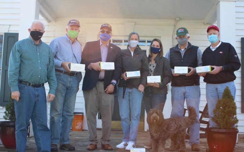 Megan Broome/The Clayton Tribune. Rotary Club members present masks to FAITH Executive Director Caroline Wallis and Director of Shelter Services Alex Clay on Monday. Also pictured are Rotarians Jef Fincher, Chip Goen, Wayne Knuckles, David Tatum and Matt Mitchum.