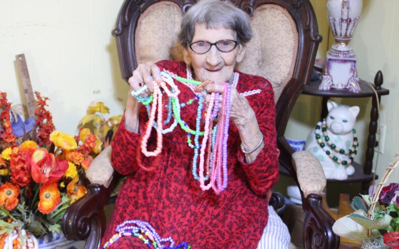 Megan Broome/The Clayton Tribune. Althalene Waters spends her days making necklaces and bracelets out of beads and finds pleasure in gifting them to everyone she meets. She was born on March 20, 1920 and turns 101 on Saturday.