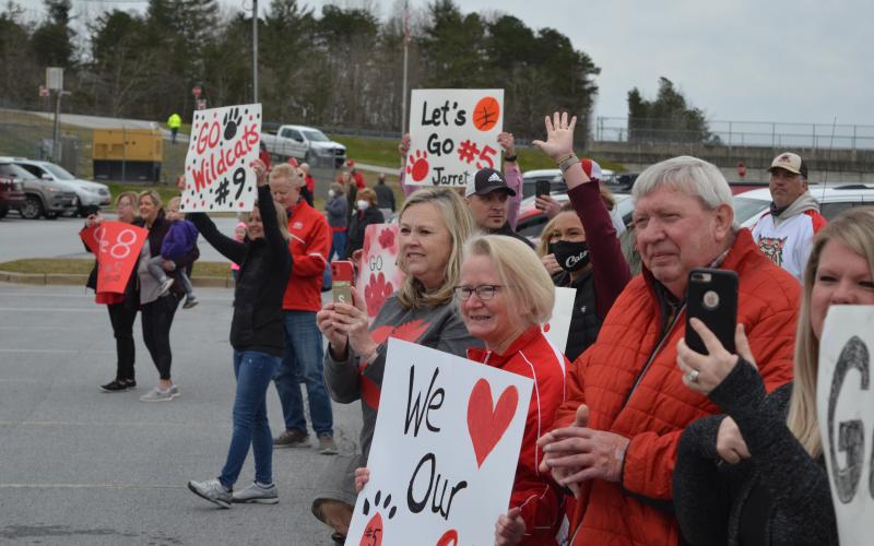 Wayne Knuckles/The Clayton Tribune. Glen and Brenda Jo Giles, along with Susan Welch, were among those cheering on the Wildcats.