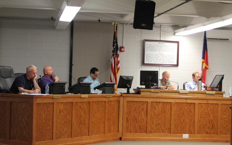 Megan Broome/The Clayton Tribune. Clayton City Council members discuss rezoning the library and other city business at last week's city council work session.
