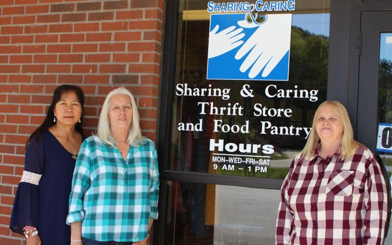 Megan Broome/The Clayton Tribune. Monthian Phillips, vice president of Rabun County Sharing and Caring, left, Gail Whitmire, food pantry manager and Linda Giles, president, are volunteers at Rabun County Sharing and Caring. The nonprofit recently moved locations to Plaza Way in Clayton after being located on Hiawassee St. since 1999.