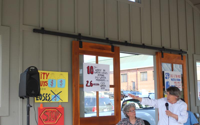 Megan Broome/The Clayton Tribune. Rabun County Coalition for Good Government member Dee Daley (right) points to statistics showing Clayton's water losses are among the 10 worst in Georgia at a public forum last week. Also pictured is Patricia Howell, moderator for the event.