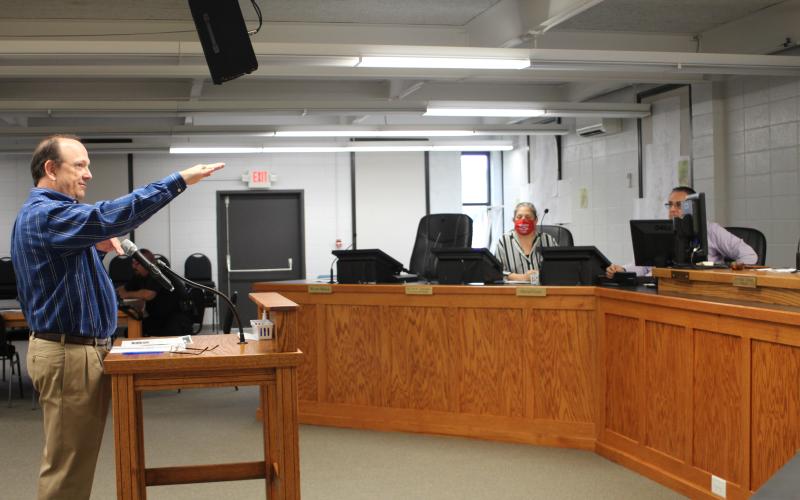 Megan Broome/The Clayton Tribune. Eric Nease, engineer for the city of Clayton, addresses council members about fixing a slope on Shadyside Dr. that resulted from damage sustained in the storm back in late March, at Tuesday’s city council meeting. Nease said that the slope has started endangering the road infrastructure and should be fixed immediately. City officials will vote on an emergency declaration next week to speed-up the repair process.