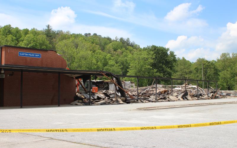 Megan Broome/The Clayton Tribune. Memories came pouring in as a portion of the old Clayton Elementary School was demolished over the past week. In May 1976, the entire Clayton Elementary School building flooded up to the waist of an adult. In the Spring of 1982, a tornado took the roof off of the library (where the Clayton court room is currently located).