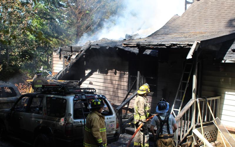 Megan Broome/The Clayton Tribune. Firefighters battle a blaze in the Vista Ridge Apartment Complex on Sunday.