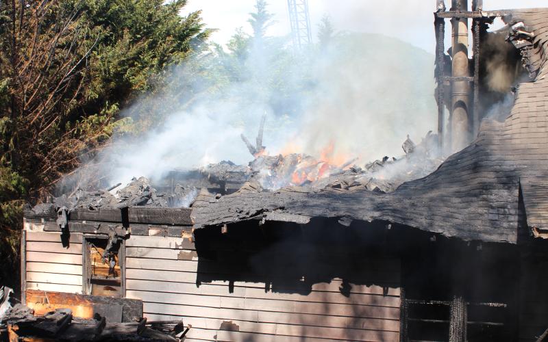 Megan Broome/The Clayton Tribune. Firefighters battle a blaze in the Vista Ridge Apartment Complex on Sunday.