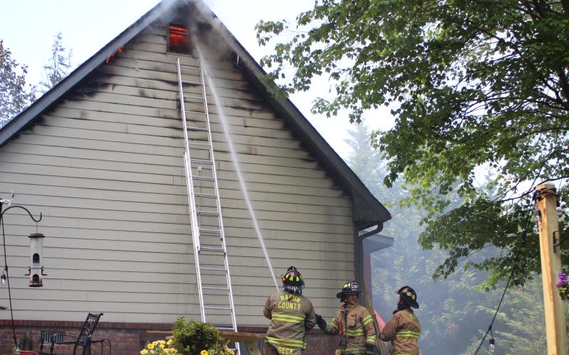 Megan Broome/The Clayton Tribune. Firefighters battle a blaze in the Vista Ridge Apartment Complex on Sunday.