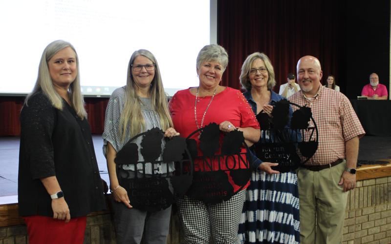Megan Broome/The Clayton Tribune. RCPS retirees were honored at the 2020-2021 retired employee reception last Thursday. Superintendent April Childers, left, and RCPS principal Jay Fowler, right, recognize RCPS retirees, from left, Cathy Shell, paraprofessional, Merrabeth Benton, assistant principal, and Robin Hurwitz, kindergarten teacher.