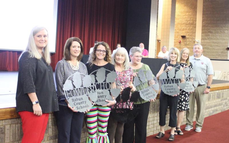Megan Broome/The Clayton Tribune. RCES retirees were honored at the 2020-2021 retired employee reception last Thursday. Superintendent April Childers, left, and RCES Principal Jonathan Welch, right, recognize RCES retirees, from left, Jill Fowler, special education teacher, Jamie Nichols, fourth grade teacher, Yvonne Ring, sixth grade teacher, Sheila Tipton, sixth grade teacher, Pam Watts, fifth grade teacher, and Marie Wheatley, sixth grade teacher.