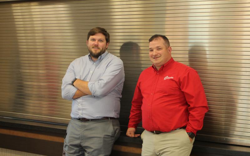 Megan Broome/The Clayton Tribune. Will Howell, student services director, left, and Marty Dixon, transportation director, attend the 2020-2021 retired employee reception held at RCHS last Thursday.