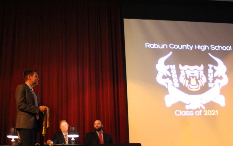 Megan Broome/The Clayton Tribune. RCHS Principal Justin Spillers presents awards to the Class of 2021 on Senior Scholarship and Awards Night held in the Fine Arts Building on May 11.