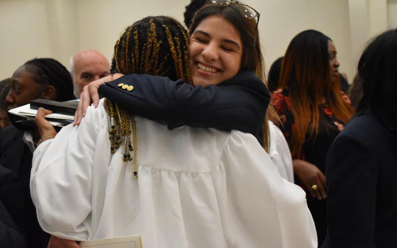 Photo courtesy Brian Wellmeier/CNI Regional Newspapers. Rising Tallulah Falls Senior Mara Radovic hugs a Tallulah Falls Class of 2021 graduate at  graduation held this past weekend.