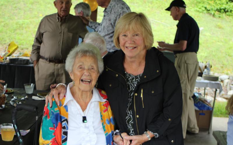 Megan Broome/The Clayton Tribune. Louise Kail, left, poses with friend Connie Taylor at a party in Sky Valley on Sunday to celebrate Kail’s 100th birthday.