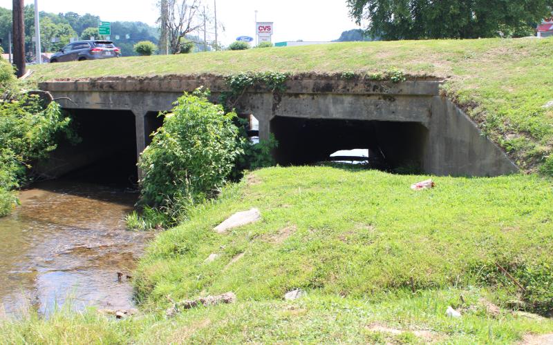 Megan Broome/The Clayton Tribune. A blocked culvert that channels Stekoa Creek under Chechero St. is obstructing the start of a green infrastructure rain garden project spearheaded by Chattooga Conservancy. The culvert has to be unblocked by city of Clayton officials before the rain garden project can begin.