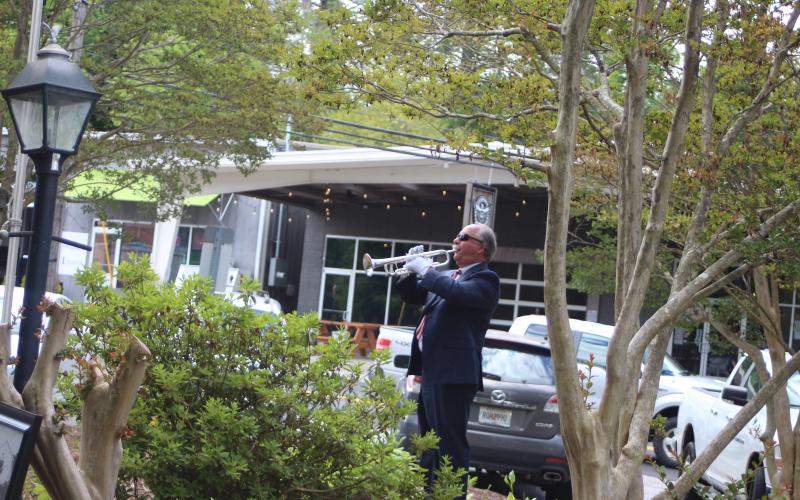 Megan Broome/The Clayton Tribune. Bugler Troy Webb played Taps at Monday’s Memorial Day ceremony to honor those veterans who have passed away.