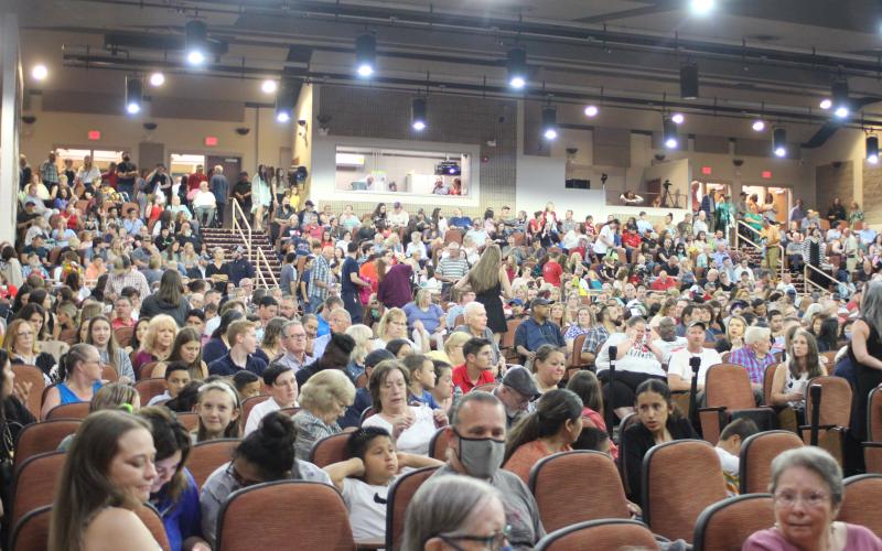 Megan Broome/The Clayton Tribune. It was standing room only in the Rabun County Fine Arts building for last Friday’s graduation for the Class of 2021. The event had to be moved inside due to a torrential downpour of rain and threats of lightning strikes in the area.