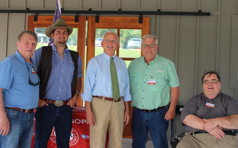 Megan Broome/The Clayton Tribune. Sam Burns, left, T.J. Dearman, chairman of the Jackson County Republican party, Gary Black, current Georgia Agriculture Commissioner, Ed Fickey, chairman of the Rabun County Republican Party, and Ed Henderson, secretary of the Rabun County Republican Party, attend the party’s ice cream social on Monday.