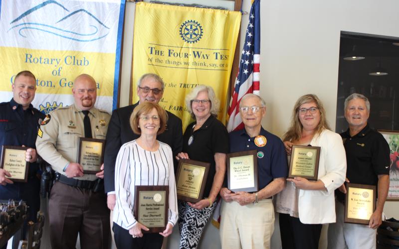 John Murray is Firefighter of the year, left, Sgt. Riley Owens is Officer of the year, Rotary Club of Clayton President Wayne Knuckles, Sue Darnell receives the Jean Harris Professional Award, Jane Janes receives the Gold R. Award, Dr. Tom Callahan receives the J.C. Dover Wheel Award, Rachel Cowart, chief nursing officer for Mountain Lakes Medical Center, receives the Wheel Award on behalf of Mountain Lakes Medical Center, and Tim Ranney receives the W. Lee Arrendale Award.