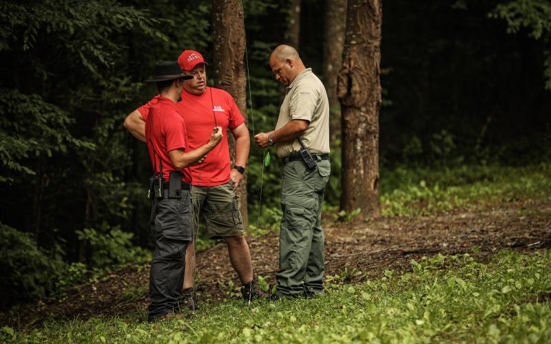 Photo courtesy of Red Bird Media. Will McCracken, chief of Rabun County Search and Rescue, left, Keith Watts, and Brian Panell, EMA director, work the scene of a drowning incident on Lake Tugalo last weekend. Georgia DNR and Rabun County EMA/Search and Rescue were the lead agencies, with help from the Oconee County, S.C. Dive Team.