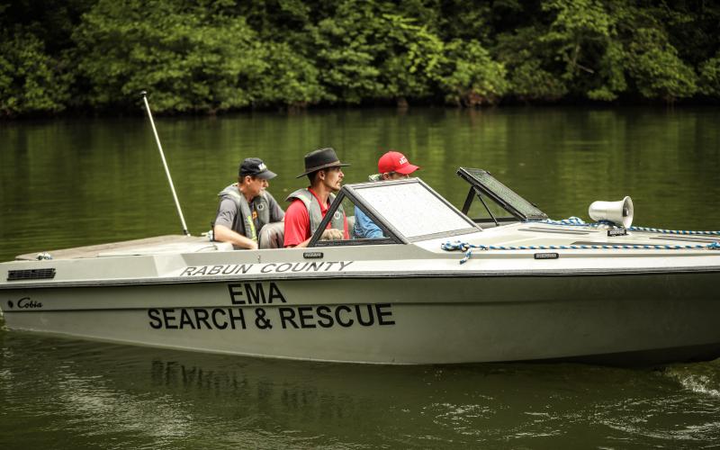 Photos courtesy of Red Bird Media. Will McCracken, chief of Rabun County Search and Rescue, left, Victor York and Chris Wright utilize the rescue boat while working the scene of a drowning incident on Lake Tugalo last 6weekend. Georgia DNR and Rabun County EMA/Search and Rescue were the lead agencies, with help from the Oconee County, S.C. Dive Team.