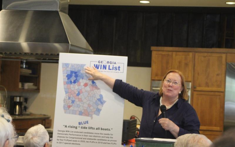 Megan Broome/The Clayton Tribune. Rabun County Democrats hosted guest speaker Melita Easters, executive director and founding chair of the Georgia WIN list, at their monthly meeting held at the Food Bank of Northeast Georgia on Monday. Easters uses charts and maps to discuss and illustrate Georgia’s history of partisan party shifts in districts on a county-by-county basis from 2016 to 2020.