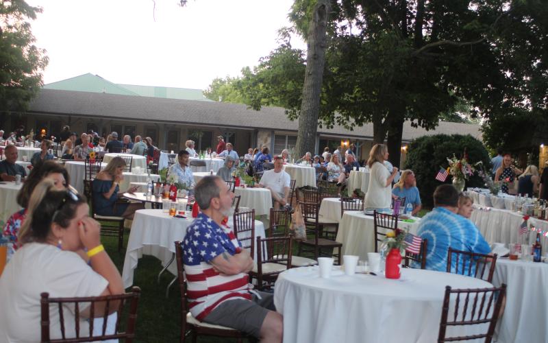 Megan Broome/The Clayton Tribune. A crowd of people dressed in patriotic attire attend an event at The Dillard House over the weekend to celebrate Independence Day. The event yielded approximately 206 people on Saturday and around 600 people for the Barbeque on Sunday.