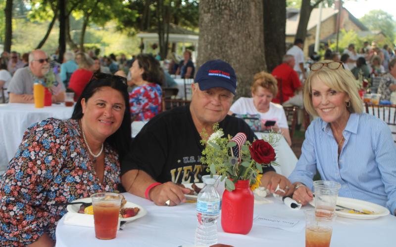 Megan Broome/The Clayton Tribune. Tena Johnson, left, Ron Johnson and Louise Dillard enjoy live entertainment from Chris Blue at The Dillard House on Sunday.