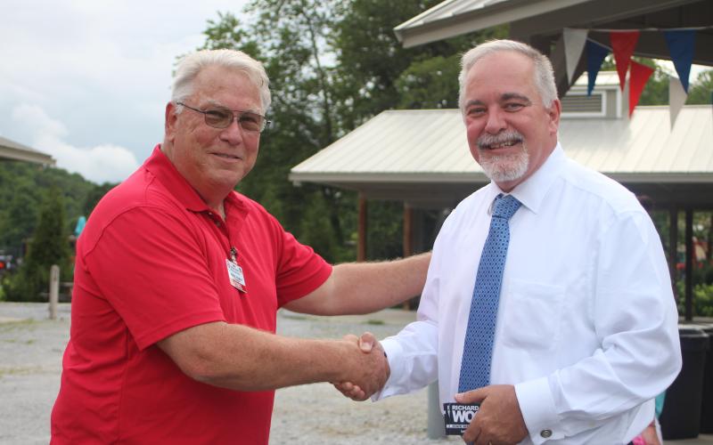 Megan Broome/The Clayton Tribune. Ed Fickey, chairman of the Rabun County GOP, shakes hands with Georgia State School Superintendent Richard Woods at a BBQ event hosted by the Rabun County Republican Party Monday. Woods was one of the guest speakers and is running for reelection in 2022.