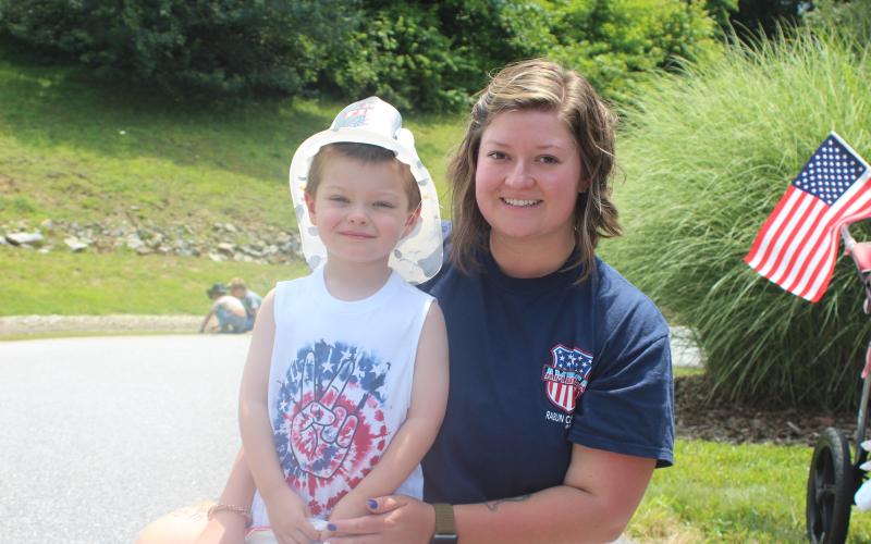 Megan Broome/The Clayton Tribune. Lincoln Marcus, 3, and Hailey Henson attend Fourth of July festivities in Sky Valley on Saturday.