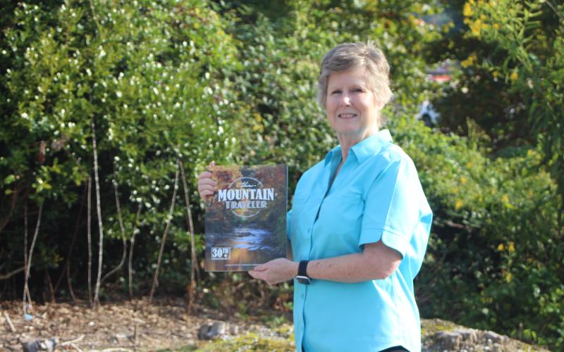Photo/Megan Broome/The Clayton Tribune. Melissa Elzey of Clayton won $100 for her photo of autumn leaves reflecting on the Tallulah River. Elzey's photo will be featured on the fall edition of The Mountain Traveler magazine, on newsstands now.