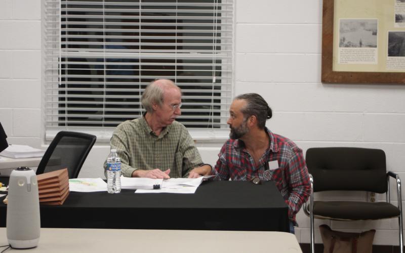 Megan Broome/The Clayton Tribune. Town Council Member Larry Hamilton, left, talks with Clint Irvin, of J&amp;D Irvin Holdings, LLC, after the council meeting last Thursday where council members voted to deny a rezoning request of 1.12 and 4.577 acre parcels on River St. and Hickory Nut Mountain Rd. from Single Family Residential (R1) to Business District (BD) for the development of short-term vacation rentals.