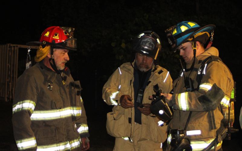 Megan Broome/The Clayton Tribune. Firefighters Boyce Speed, left, Boyd Speed and Zackery Scruggs.