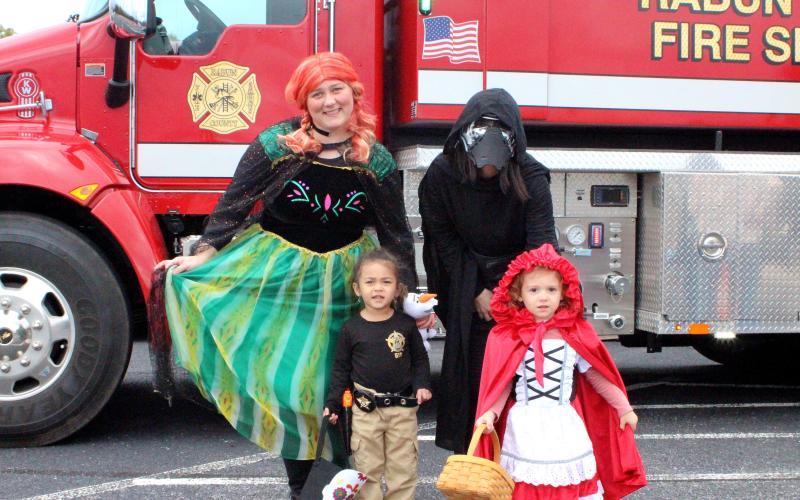 Megan Broome/The Clayton Tribune. Ana Contreras, left, Galina Neel, Tiana Contreras, 2, and Eva Neel, 3, Trick or Treat at last Saturday’s Trunk or Treat.