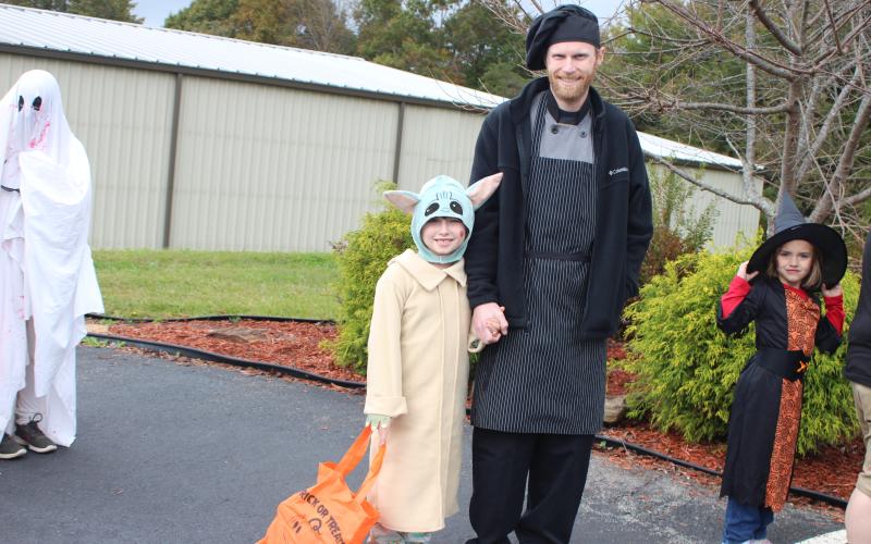 Megan Broome/The Clayton Tribune. Suzie Dillard, 6, left, and Tyler Dillard go Trick or Treating last Saturday.