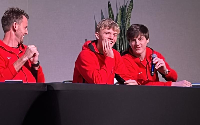 Matthew Osborne/CNI News Service Rabun County boys basketball coach David Adcock (left) shares a laugh with players Gus Hood (center) and Connor McKay at FCA basketball media day Nov. 3.