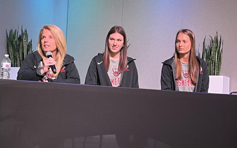 Matthew Osborne/CNI News Service Rabun County girls basketball coach DeeDee Dillard (left) responds to a question at FCA basketball media day along with players Gracie Deetz (center) and Carley Haban.
