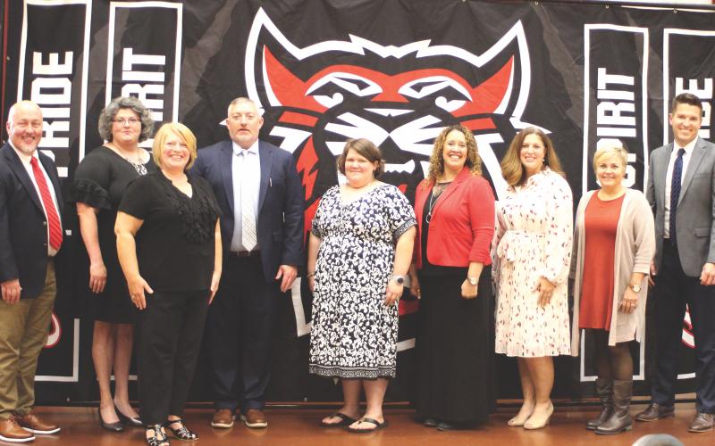 Megan Broome/The Clayton Tribune. RCPS Principal Jay Fowler, left, Laura Welborn, Gretchen Grant, RCES Jonathan Welch, Candace Mathis, RCMS Principal Kechara Partin, Alicia McCracken, Shelley Drummond, and RCHS Principal Justin Spillers.