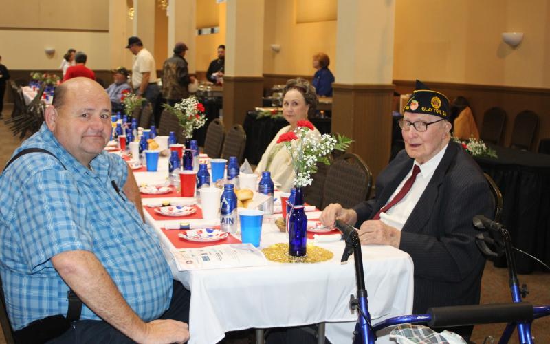 Megan Broome/The Clayton Tribune. Anthony Worley, left, and Korean War Army Veteran Lloyd Hunter at the Veterans Appreciation Dinner held at the Rabun County Civic Center last Thursday. (Attendee Martha Scruggs appears in the background).