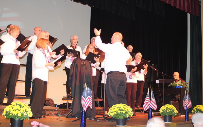 Megan Broome/The Clayton Tribune. The choir from Clayton First United Methodist Church sings at the Veterans Appreciation Dinner Nov. 11. The choir is directed by George James.