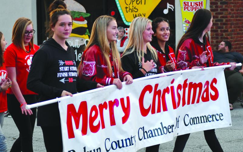 Enoch Autry/The Clayton Tribune. The chamber of commerce and Forward Rabun serve as parade sponsors. Carrying the banner are cross country members Willow Fisher, Trea Blalock, Molly Jo Wright, Itzia Vasquez and Molly Mazarky.