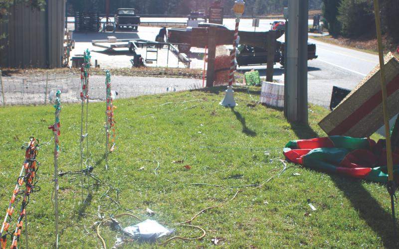 Megan Broome/The Clayton Tribune. Several decorations were stolen from the Christmas Village of Lights display in Tiger. Suspects stole two white and two multi-color light Christmas trees that were displayed and left the stakes that were holding them down from the wind. The computer control box and extension cords that power the display also were damaged.