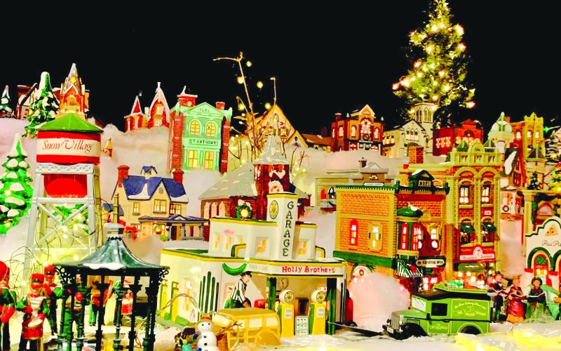 Photo courtesy of Jenifer Kulow/The Clayton Tribune. Visitors to the Christmas Village of Lights travel the path outlined with candy canes to visit Santa and Mrs. Claus and the miniature village display located indoors. Visitors can also take part in a scavenger hunt through the village sets.