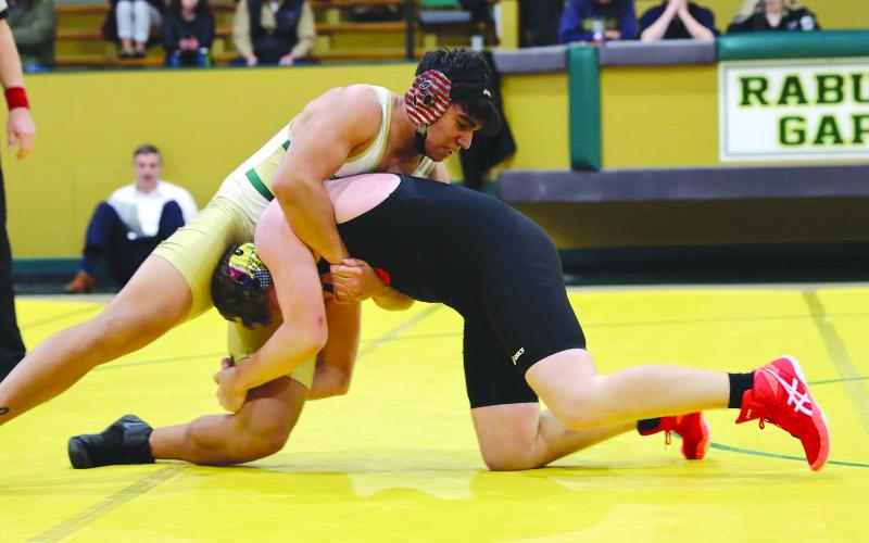 Photo courtesy of Rabun Gap-Nacoochee School. Joaquin Acuna, left, wrestles for Rabun Gap on Jan. 7 during the team’s home opener. The Eagles defeated Southlake Christian and Wesleyan Christian School.