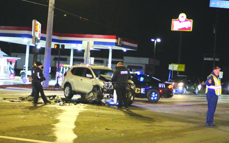 Megan Broome/The Clayton Tribune. Officials investigate one of the three vehicles involved in a Jan. 20 crash on Ga. 15 in Clayton.