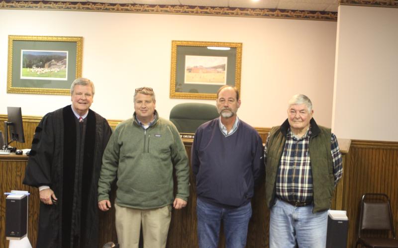 Megan Broome/The Clayton Tribune. Dillard candidates for mayor and council member positions were sworn-in to office Tuesday by Probate Judge Carlton H. Jones III in the Probate Courtroom at the Rabun County Courthouse. Probate Judge Carlton H. Jones III, left, Mayor Claude Dillard, Council Member Jeff Harris and Council Member Tremaine “Terry” Wilson pose for photographs following the ceremony.