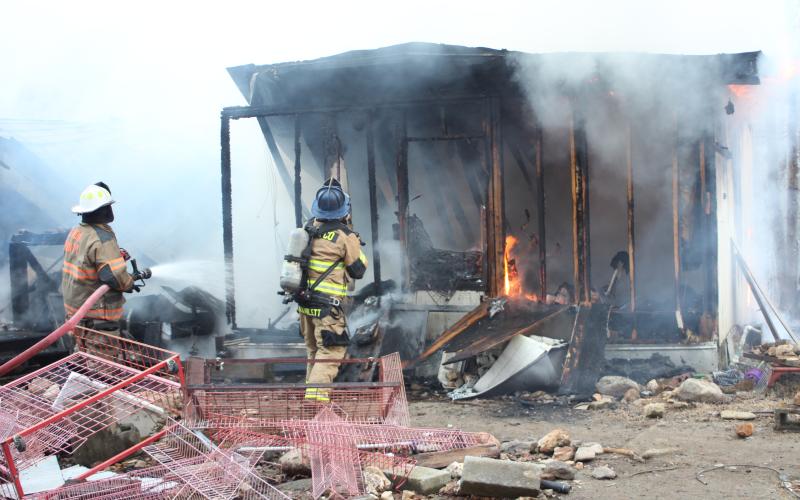 Megan Broome/The Clayton Tribune. Rabun County Fire Services work the scene of a structure fire at 453 Dan Crane Rd. Tuesday. No injuries were reported. The cause of the fire is under investigation.