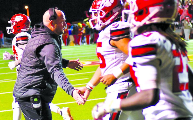 Enoch Autry/The Clayton Tribune. Jaybo Shaw applauds his Wildcat players’ effort during Shaw’s last game as RCHS head football coach in Thomasville in the Class AA state quarterfinals. The Wayne County school board approved Shaw as the Class 5A Jackets’ new head football coach and assistant athletic director. Shaw, who also served as the RCHS athletic director, will start in Jesup on Jan. 17.